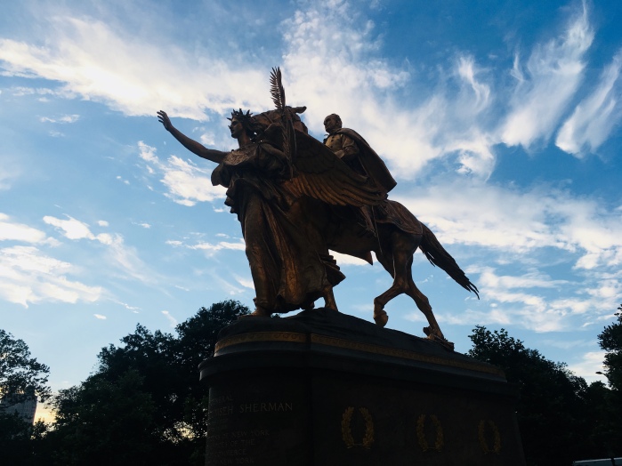 The statue at one of entrances of Central Park